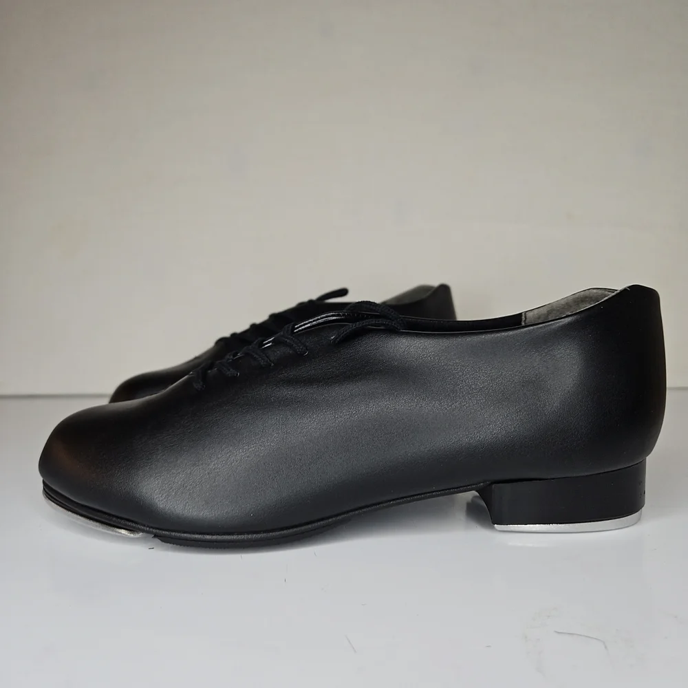 Lace-up tap shoe with a sleekSoft PU leather upper Plastic sole with rubber